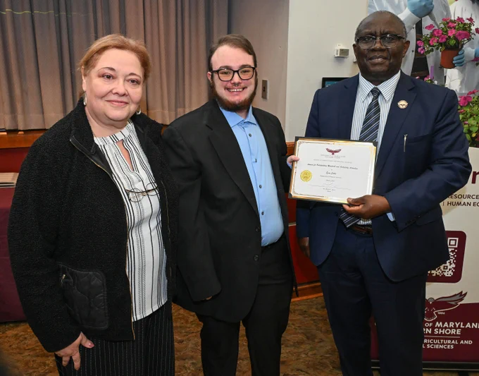 Graduate Assistants Awards: Outstanding Research and Scholarly Activities winner Ezra Cable with Dean Dr. Moses T. Kairo and Dr. Victoria Volkis at the SANS end of the year awards May 8, 2026. 