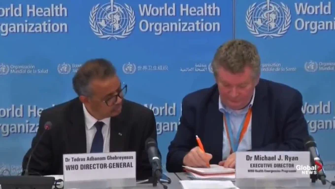 WHO press conference where Tedros and Mike Ryan are sitting in front of microphones and Mike Ryan is frantically scribbling a note to Tedros after he said that covid is airborne.