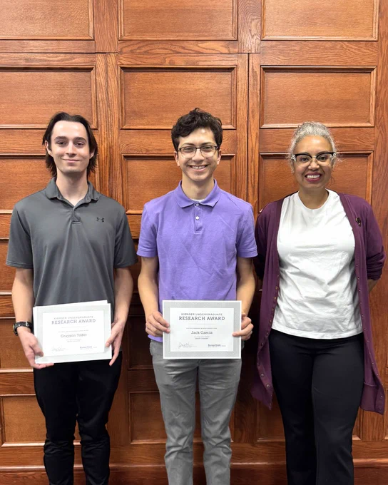 Kirmser Research Award recipients Jack Garcia and Grayson Yoder pose with their certificate alongside Associate Dean Tara Coleman.