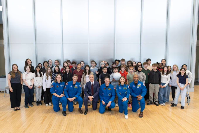 Prime Minister Mark Carney poses for a photo with young students, Canadian Space Agency astronauts Jeremy Hansen and Jenni Gibbons, and the Artemis II crew members Reid Wiseman, Victor Glover, and Christina Koch, at the Canadian Museum of Nature in Ottawa.