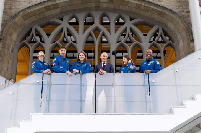 Prime Minister Mark Carney stands next to Canadian Space Agency astronauts Jeremy Hansen and Jenni Gibbons, alongside the Artemis II crew members Reid Wiseman, Victor Glover, and Christina Koch at the Canadian Museum of Nature in Ottawa.