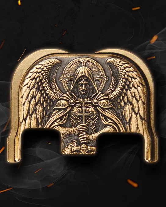 Brass St. Michael engraved rear plate displayed against a dark textured background with drifting smoke and ember sparks.