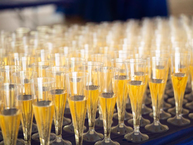 A table full of champagne glasses. 