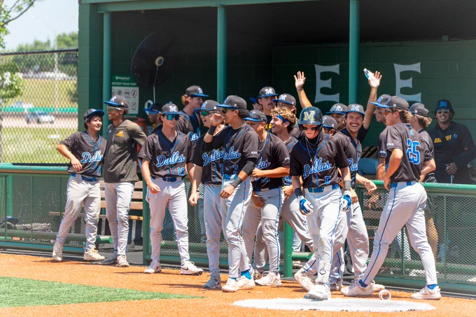 Dallas College Mountain View baseball players celebrate out of the dugout in the Lions' first postseason win in program history. 