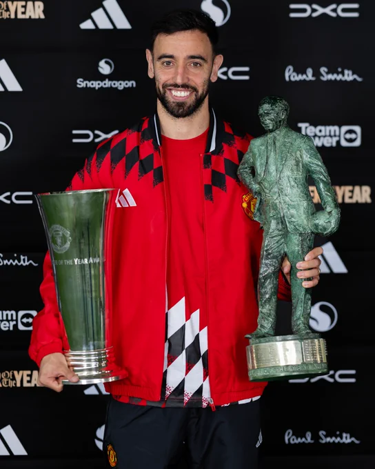Bruno Fernandes poses with his Players' Player of the Year award and his Sir Matt Busby Player of the Year award.