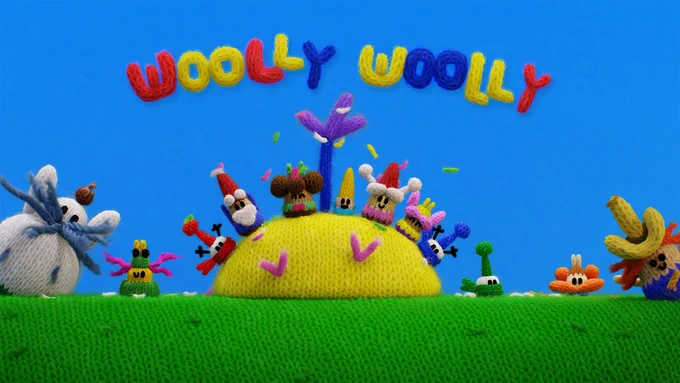 Colourful key art for Woolly Woolly. Five knitted gnomes and their woolly friends gather on a yellow hill in a bright blue and green knitted world, with the title spelled out in multicoloured yarn across the top.