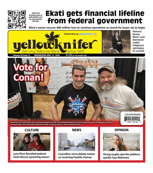 A composite image of the front page of the Yellowknifer newspaper dated May 13, 2026. The main headline discusses a financial lifeline for the Ekati mine. Several photos are featured, including a portrait of a smiling woman in a forest, two women sitting together on a couch, and a street view of Franklin Avenue. At the bottom, a photo shows two men, Jeremy Flatt and Eli Purchase, standing at a Fair Vote NWT booth during a trade show. They are holding a sign that says Ask Me About Proportional Representation and a humorous poster that says Vote for Conan. A QR code in the top left corner encourages readers to find local news online.