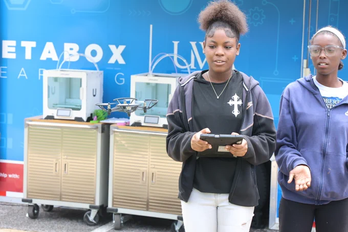 Student operating a drone.
