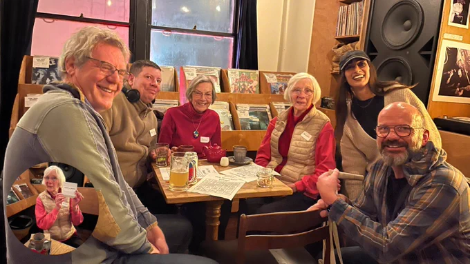 A group of volunteers sitting around a table at one of our evening socials.