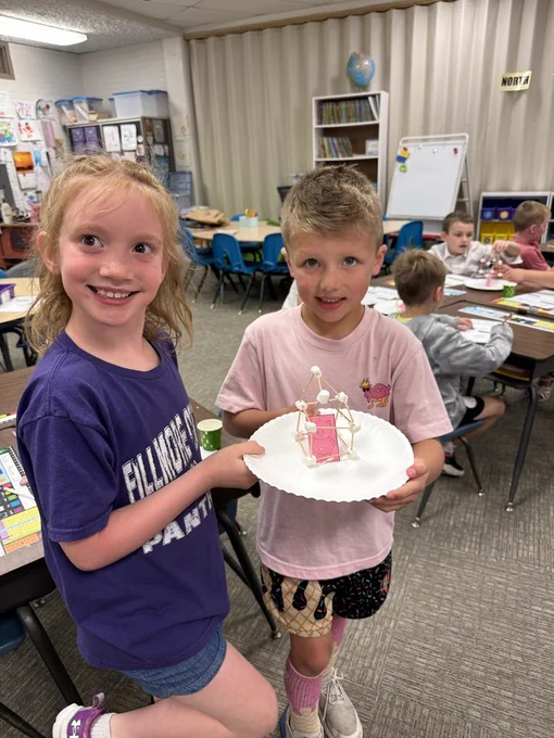 First graders reading the 3 little pigs. 