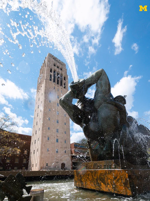 Mostly blue skies above the Central Campus fountain and Burton Tower.