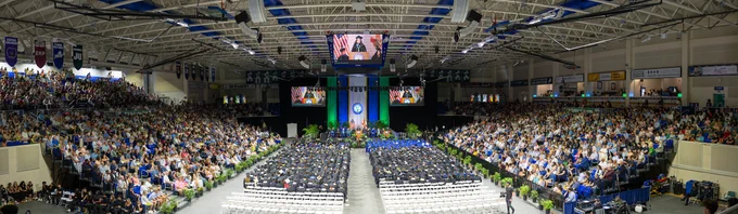 a photo of alico arena full during a commencement ceremony