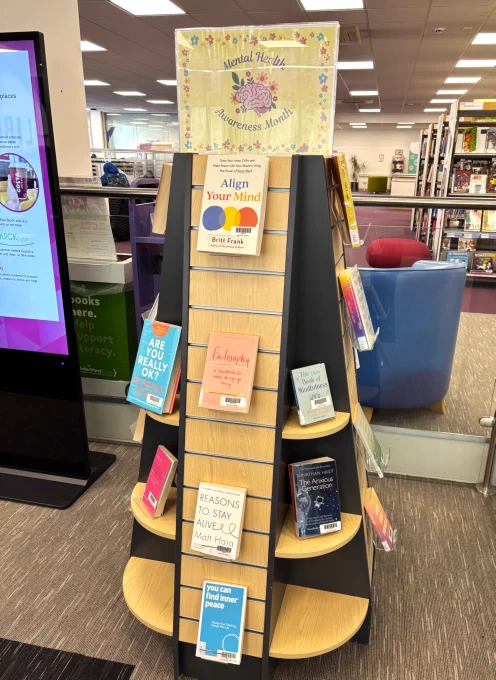 A "Mental Health Awareness Week" book display with a selection of books on Mental Health and Wellbeing.