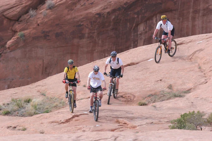 Former Governor Huntsman biking in Moab on red rock