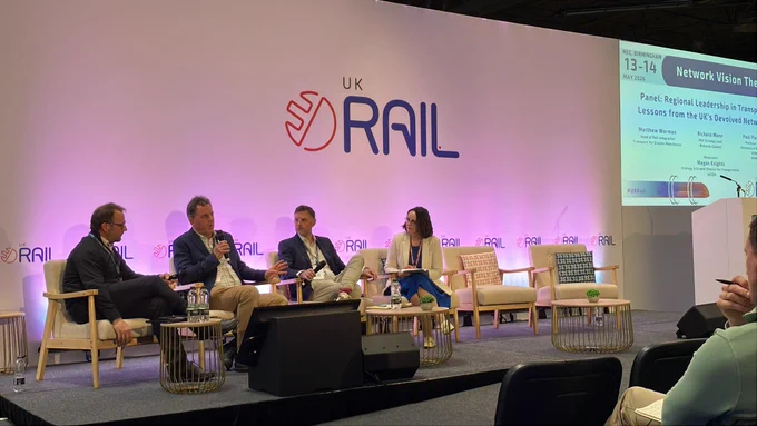 Photo of Richard talking on a panel discussion at Rail UK 2026.