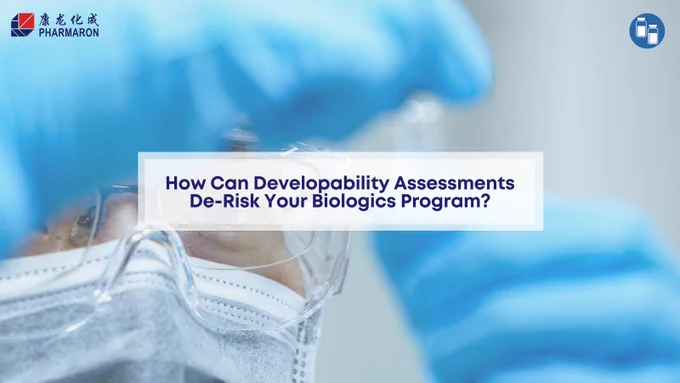 Ensure Success from Discovery with Pharmaron’s Developability Assessment Services. Image of a person wearing safety glasses, a face mask, and blue gloves in a laboratory setting, underscoring the importance of precision and safety in the developability assessment process.