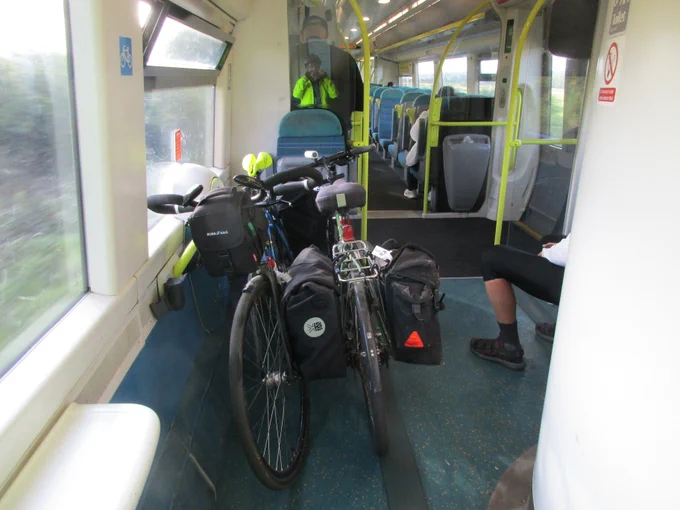 Bikes secured in the designated shared space by the toilet.