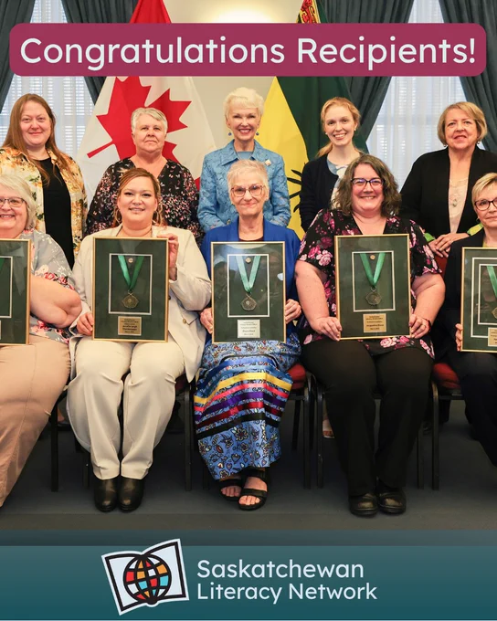 This picture is of ten adults in two rows of five. In the centre of the group is the Lieutenant Governor of Saskatchewan, Her Honour the Honourable Bernadette McIntyre. The award recipients are sitting in front row on chairs, each of them smiling and holding the Saskatchewan Literacy Award of Merit they received, presented by the Lieutenant Governor of Saskatchewan. Four Saskatchewan Literacy Network employees and board members are standing in the back row on either side of the Lieutenant Governor. The caption reads 'Congratulations Recipients!' and the post is from the Saskatchewan Literacy Network. The Network logo is in the lower middle section and has a stylized book with a stylized globe in front of it, symbolizing the world of opportunities that are possible through literacy and learning. www.saskliteracy.ca  