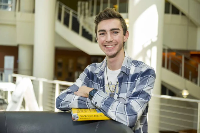 Michael Silas poses in the atrium of the Ford Environmental Science and Technology Building.