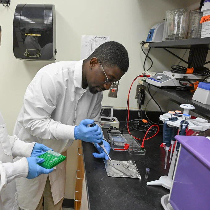 Richard Otwey, UMES Ph.D. student, tests for salmonella inside a lab on campus. 