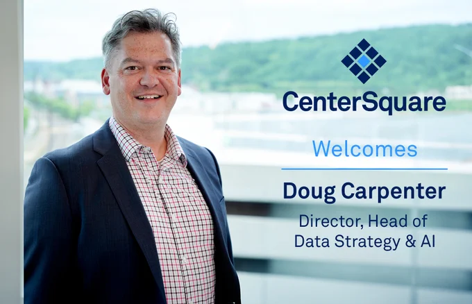 A professional welcome graphic featuring a smiling man in a navy blazer and checkered button-down shirt standing in front of large office windows with a blurred outdoor landscape in the background. The graphic includes the CenterSquare logo and text reading: “CenterSquare Welcomes Doug Carpenter, Director, Head of Data Strategy & AI.”