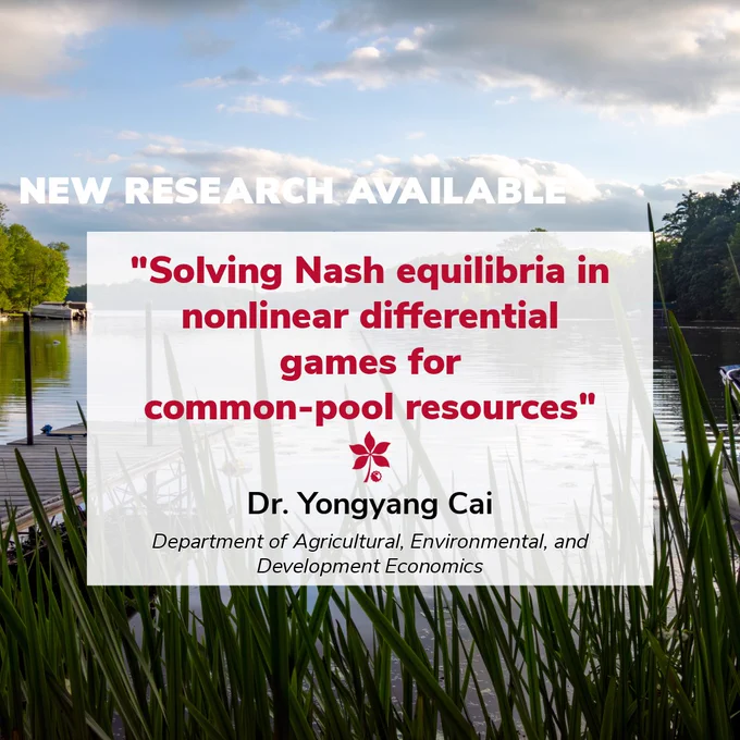 A calm lakeside scene shows still water reflecting a partly cloudy sky. Tall green grasses fill the foreground, and a wooden dock extends into the lake from the left. Trees line the far shore. Over the image, a white text box announces new research titled “Solving Nash equilibria in nonlinear differential games for common‑pool resources” by Dr. Yongyang Cai of the Department of Agricultural, Environmental, and Development Economics.