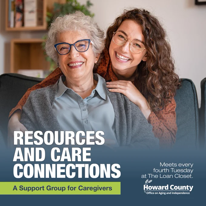 An older woman and a younger woman embrace on a couch, promoting a caregiver support group in Howard County.