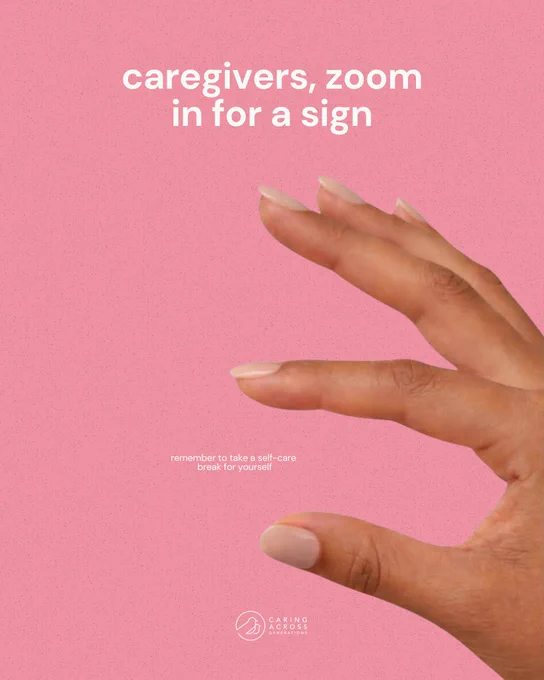 A hand is positioned against a pink background, with fingers forming a pinch gesture. The text reads: "caregivers, zoom in for a sign" and "remember to take a self-care break for yourself." A logo at the bottom reads "Caring Across.