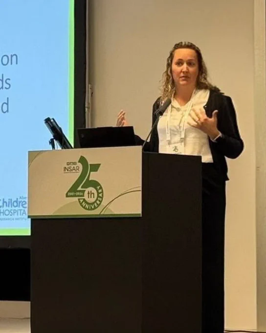 Stephanie Andreasen presents her work on stage at the International Society for Autism Research (INSAR) Conference. Steph presented on the impact of diagnostic timing on healthcare use: statistical trends among early and late diagnosed youth.