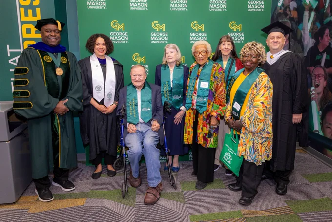 The Golden Patriots pose with President Gregory Washington during the VIP reception prior to the 2026 Spring Commencement at EagleBank Arena on Thursday, May 14, 2026. Photo by John Boal/George Mason University
