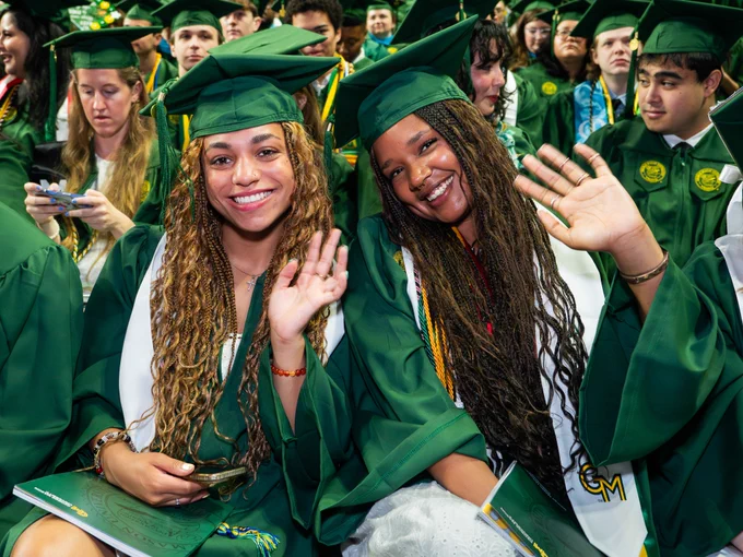 Graduates celebrate before the 2026 Spring Commencement at EagleBank Arena.     Photo by Andani Munkaila/Creative Services/George Mason University