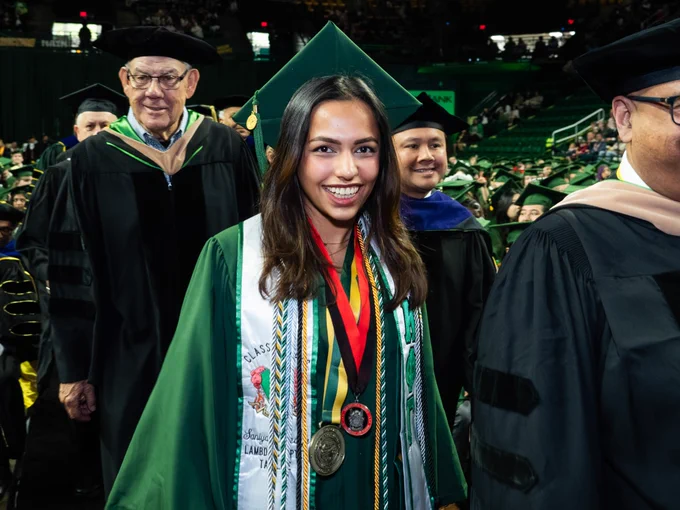 Student speaker Saniya Dilip Darediya addresses fellow graduates and guests during the 2026 Spring Commencement at EagleBank Arena. Photo by Andani Munkaila/Creative Services/George Mason University