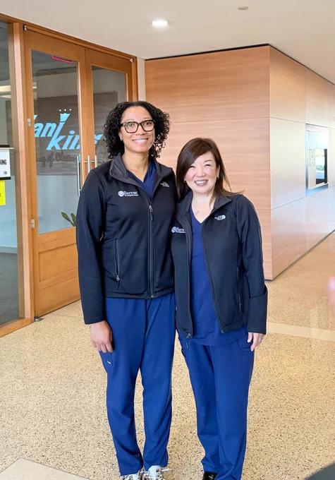 Dr. Wiggins and Dr. Lee-Iannotti pose for a photo at the radio station