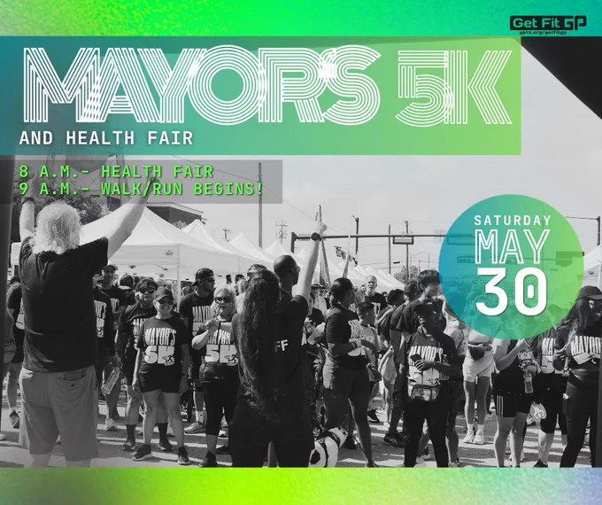 Participants in matching Mayor's 5K shirts prepare for the walk/run event at a health fair on May 30.