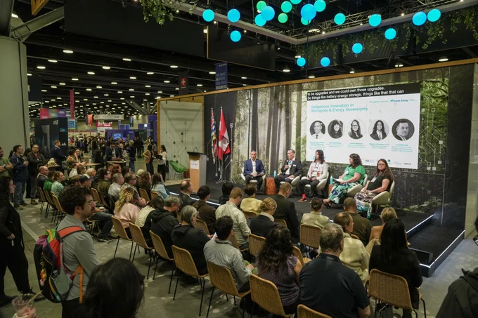 Panelists on stage speak to an audience at the BC Pavilion at Web Summit Vancouver 2026.