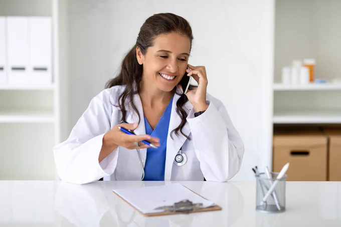 pharmacist on phone educating patient
