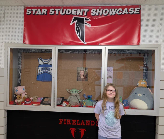 Student in front of display 