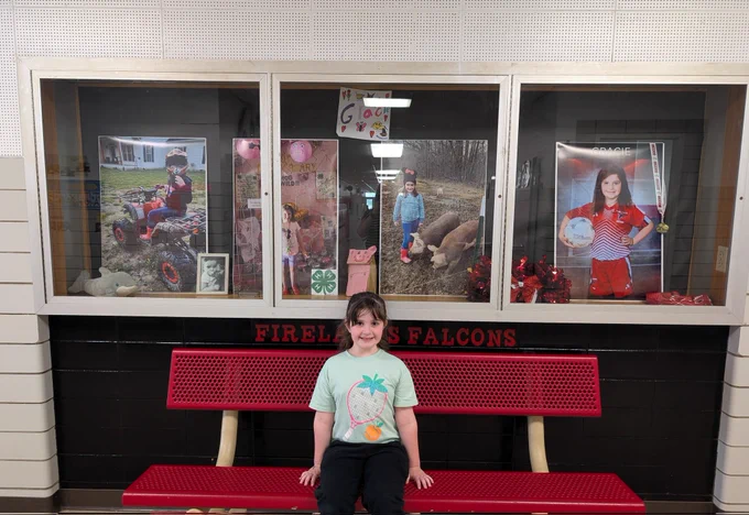 Student in front of display 