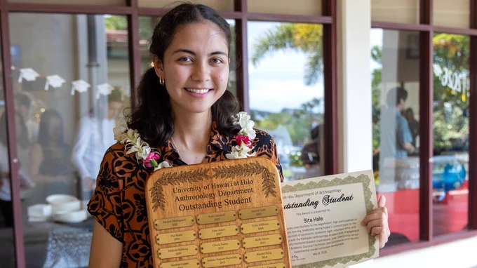 Anthropology student Sita Hale holds her department’s perpetual plaque after receiving the UH Hilo Department of Anthropology Outstanding Student Award, May 8, 2026, at the College of Arts and Science’s annual Student Award Convocation Celebration. (Photo: University Relations/UH Hilo)