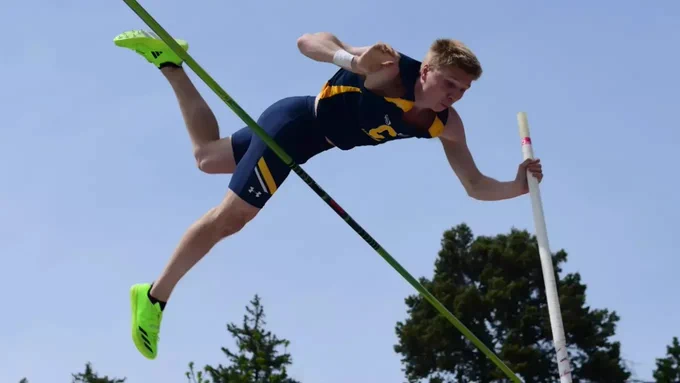 Soren Kaster clears the bar in the pole vault