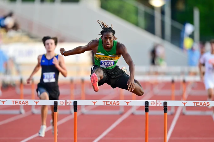 Avonte Earl jumping over a hurdle.