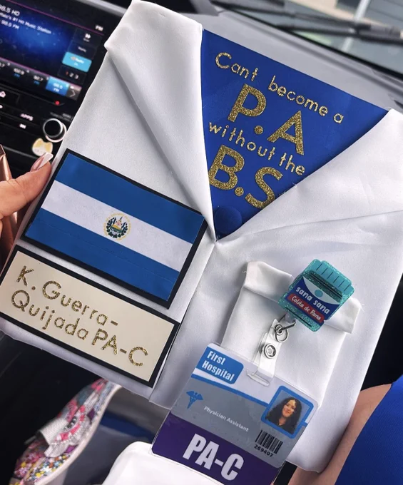 A graduation cap decorated to look like a physician's coat, complete with a badge, El Salvador flag, and the words \"Can't become a P A without the B S\"