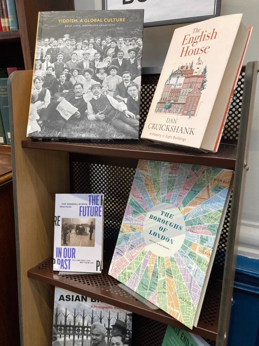 Part of a new books display showing four titles.