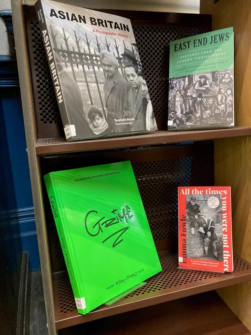Part of a new books display showing four titles.
