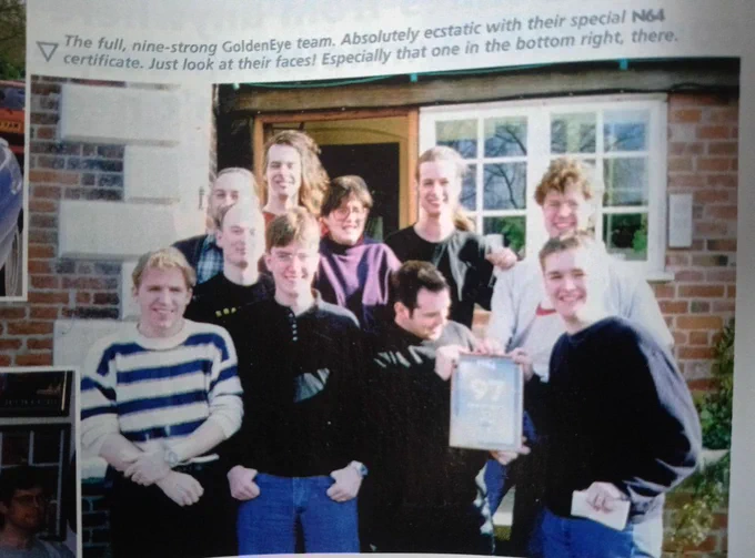 From left to right: Karl Hilton, David Doak, Graeme Norgate, Grant Kirkhope, Steve Ellis, B. Jones, Duncan Botwood, Martin Hollis, Mark Edmonds. Tim Weaver of N64 Magazine in the bottom right, delivers the award.