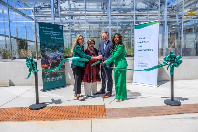President Guskiewicz cutting ribbon at MSU Greenhouse Renovation Ribbon-cutting.
