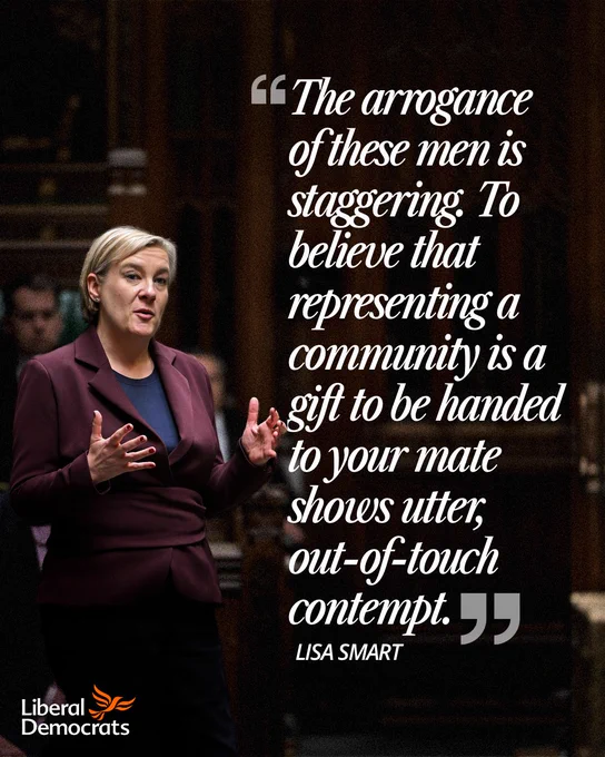 Lisa Smart speaking in Parliament, wearing a burgundy suit jacket and gesturing with both hands.

 Overlaid text reads: “The arrogance of these men is staggering. To believe that representing a community is a gift to be handed to your mate shows utter, out-of-touch contempt.”