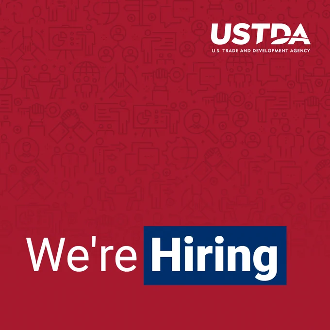 Banner with red abstract background and blue and white text. Text includes the USTDA logo and reads "We're Hiring." 