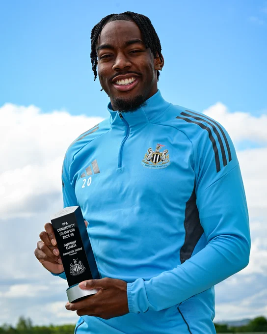 Anthony Elanga posing with the PFA Community Champion award for 25/26. 