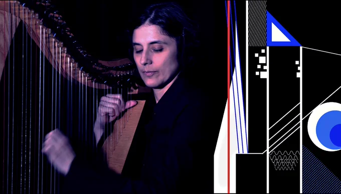 A harp player on the left; on the right, white shapes -- lines, boxes, squares, a triangle, a series of blue and white circles embedded inside one another... as the score runs alongside the live player.